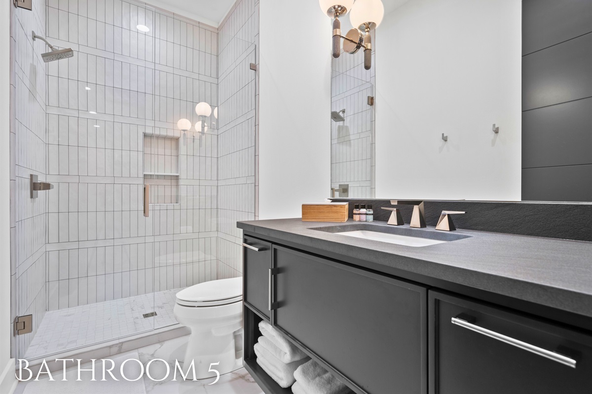 Step into this luxurious bathroom and enjoy the modern amenities and elegant design that make it a perfect retreat.