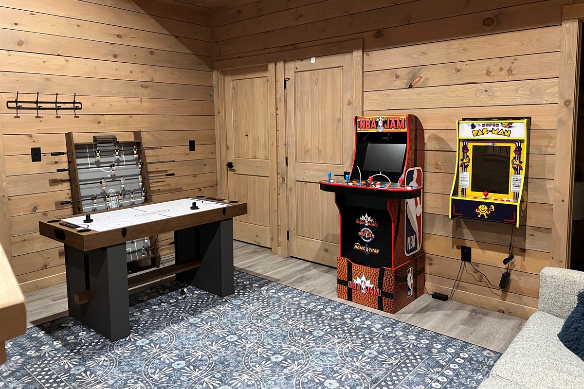 Updated game room with 2 arcades and a game table with air hockey/foosball