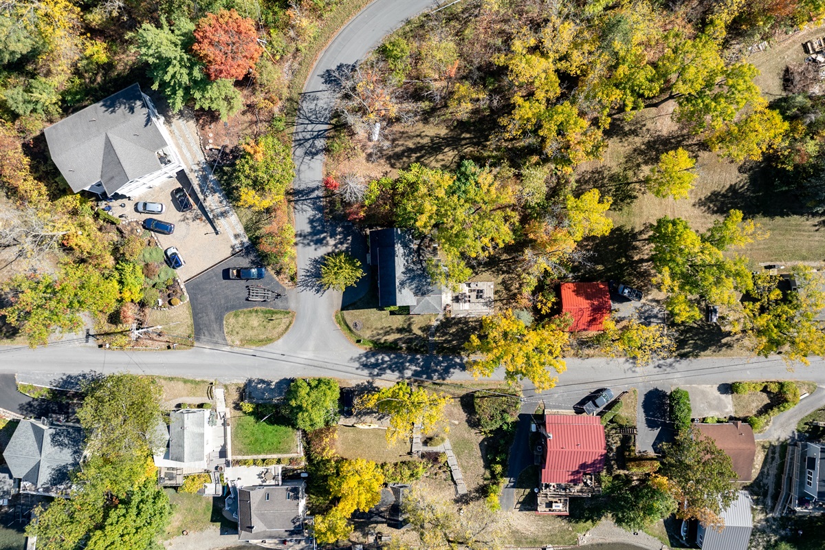 Nestled among colorful fall trees, this peaceful lake community offers the perfect mix of nature and charm