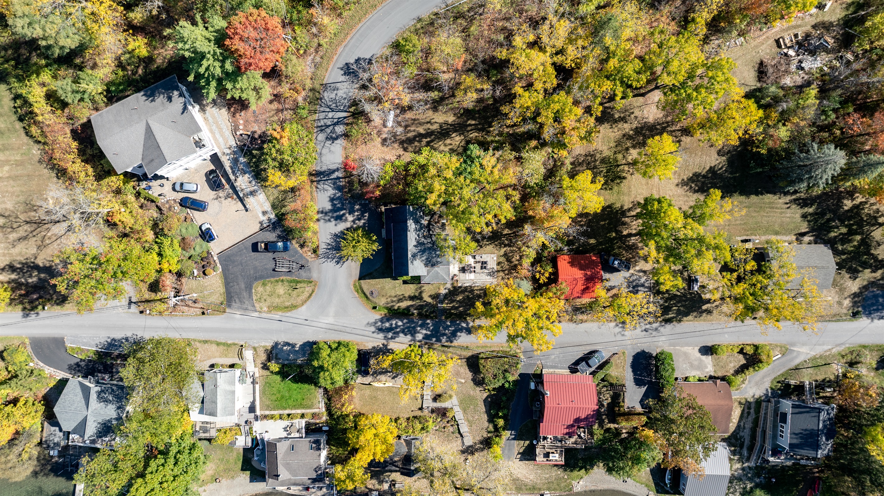 Nestled among colorful fall trees, this peaceful lake community offers the perfect mix of nature and charm