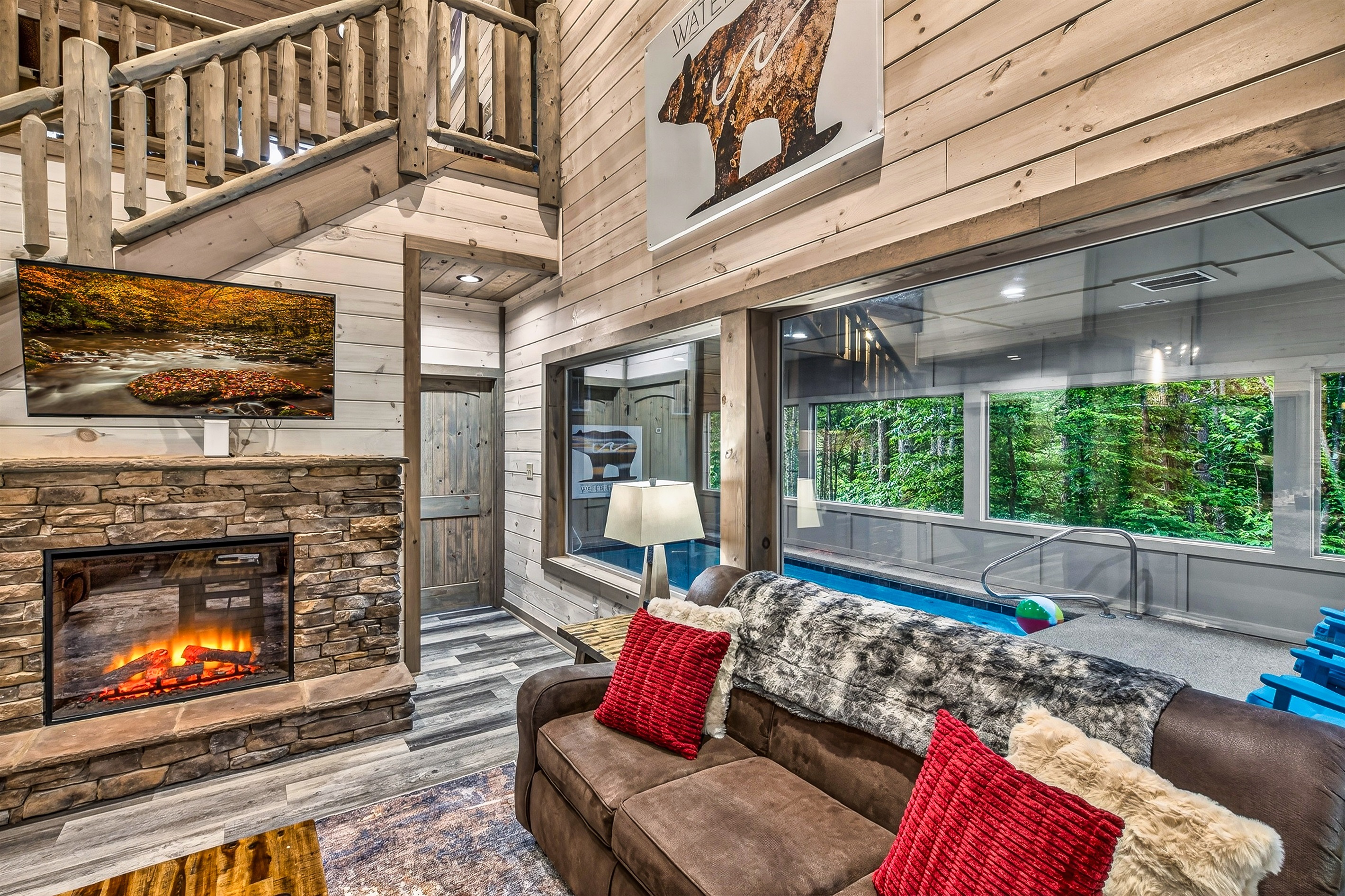 Roku TV and Electric Fireplace with View of the Pool. Really great layout for family. View of pool from living room!