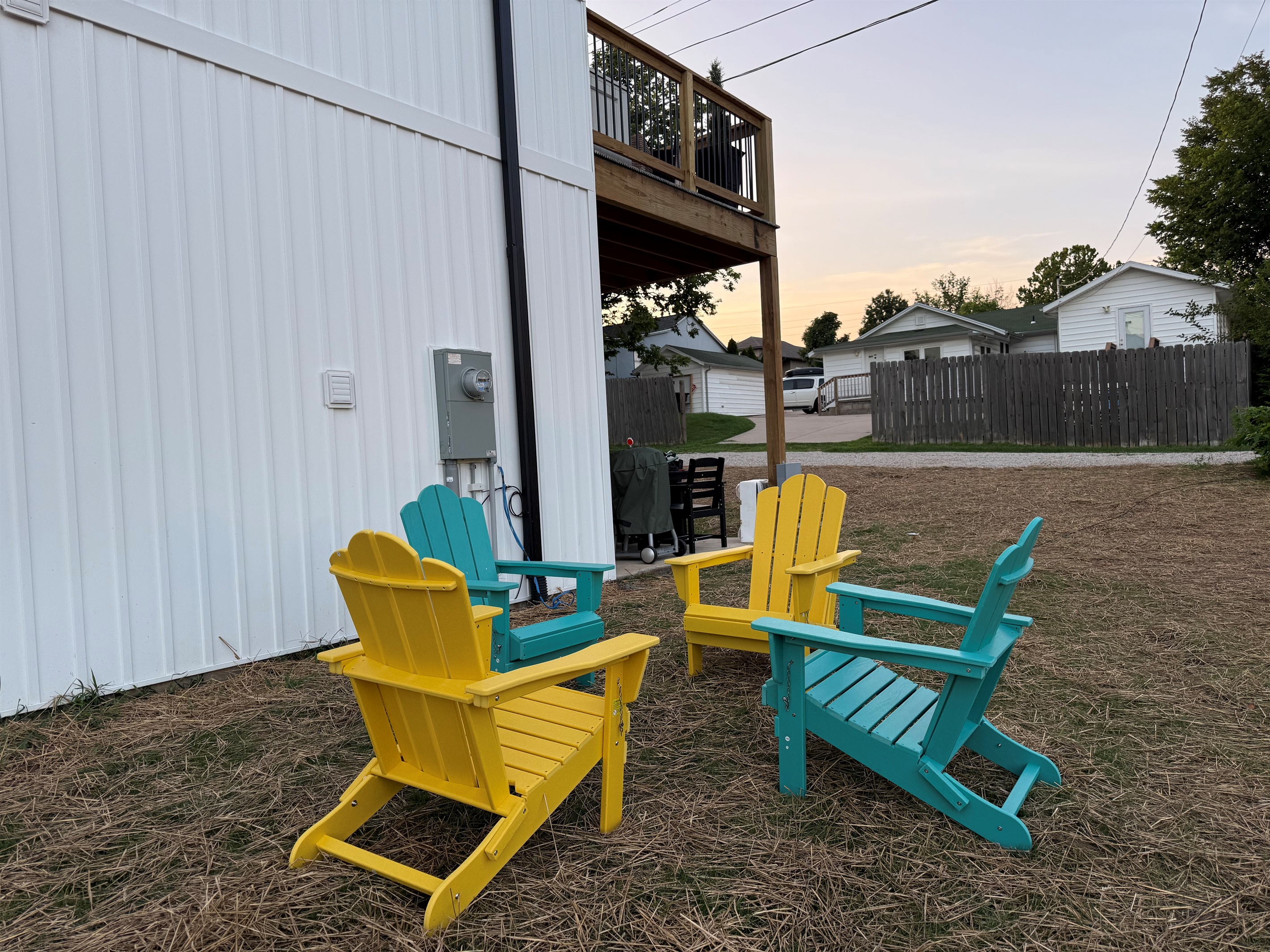 Outdoor seating on side of home. Fire pit will be installed once grass has grown this fall