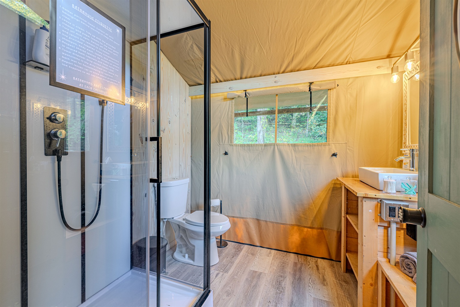 A clean, bright space to refresh. We've blended natural wood with sleek, modern fixtures to give you a true at-home shower experience—complete with an actual toilet, too!