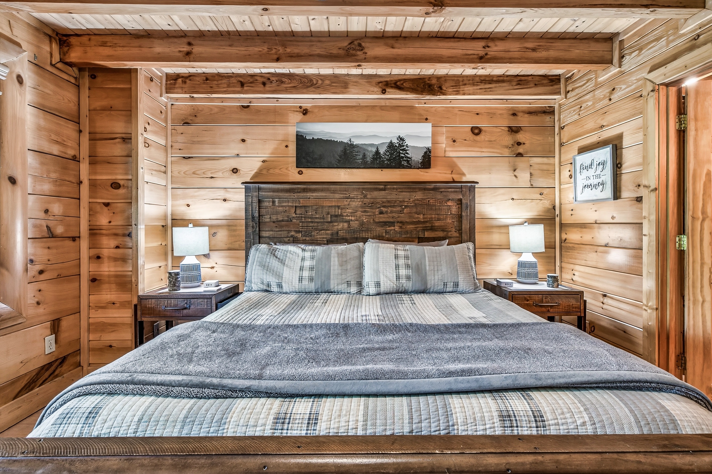 King bed in the front bedroom.  Bedroom includes an en-suite bathroom.