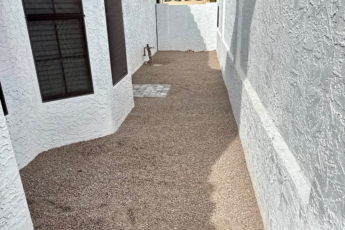 Dog door leads to Soft Scape Dog Run