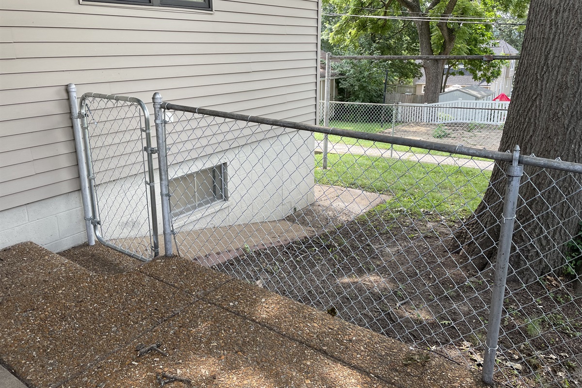 Fenced backyard with gate