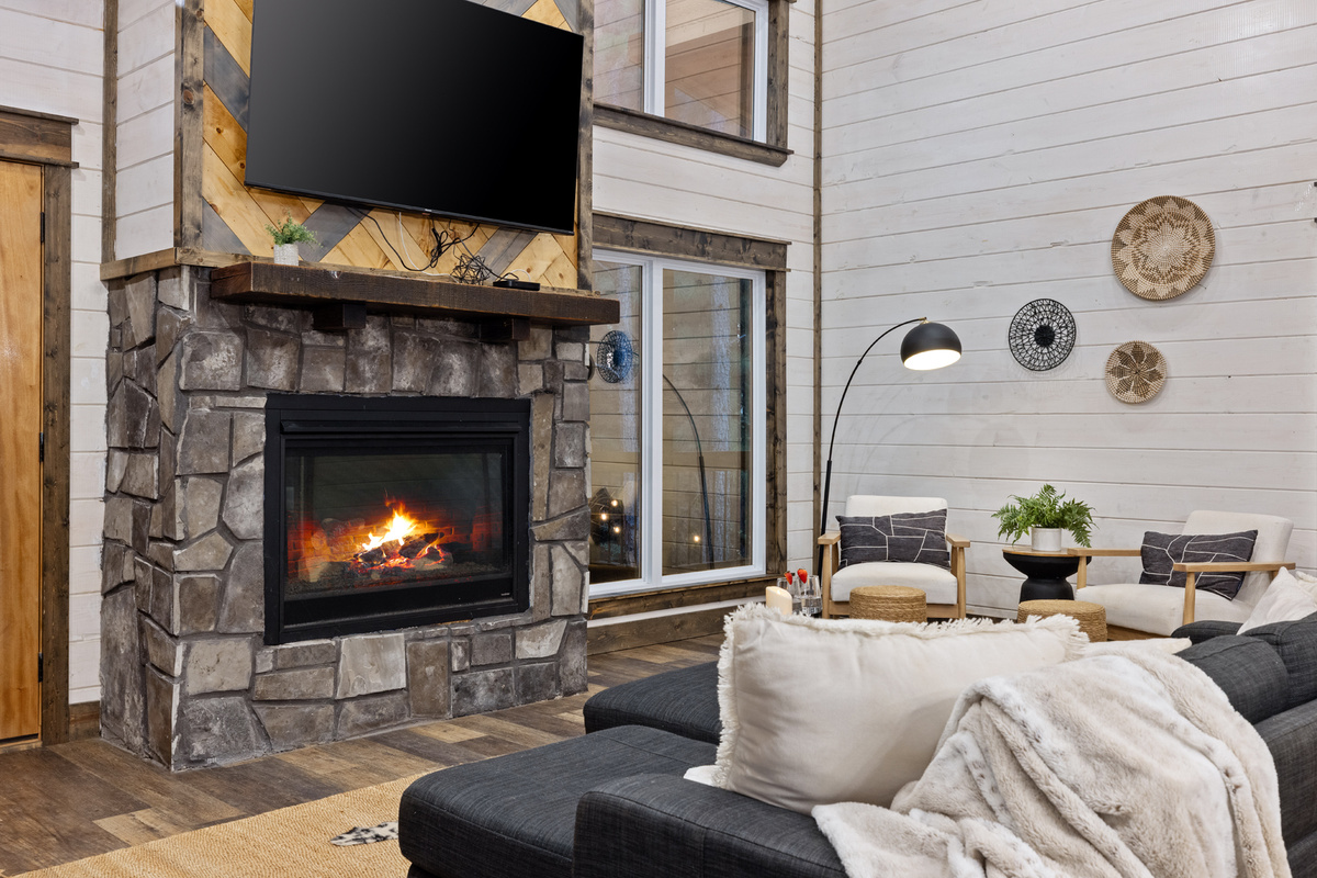 Come back inside, kick your feet up, and let the fireplace do the rest. This is the cozy cabin moment you picture when you book a getaway in the woods.