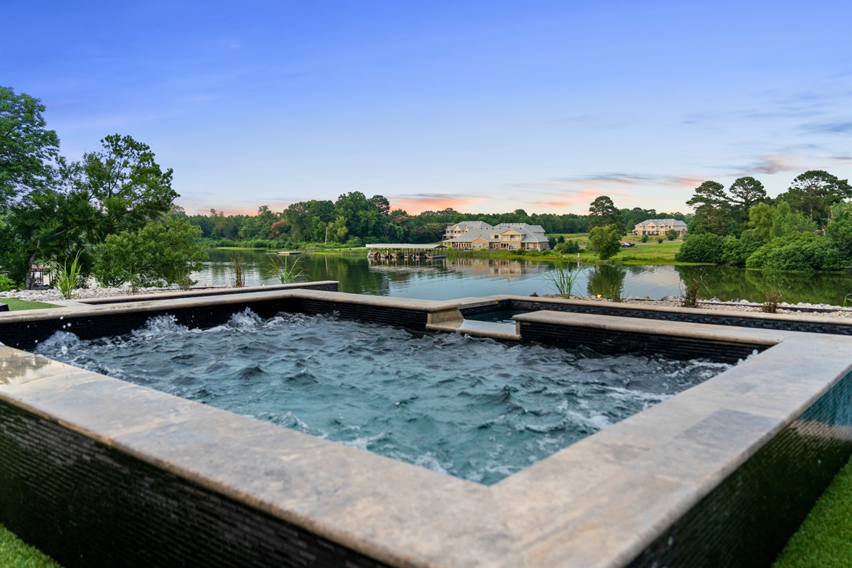 Enjoy the soothing sounds and stunning views as you relax in our luxurious lakeside hot tub, perfect for unwinding after a long day.
