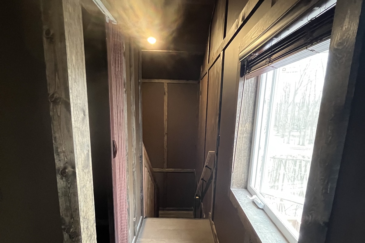 The loft floor has a back area with a nook that has a king over king bunkbed