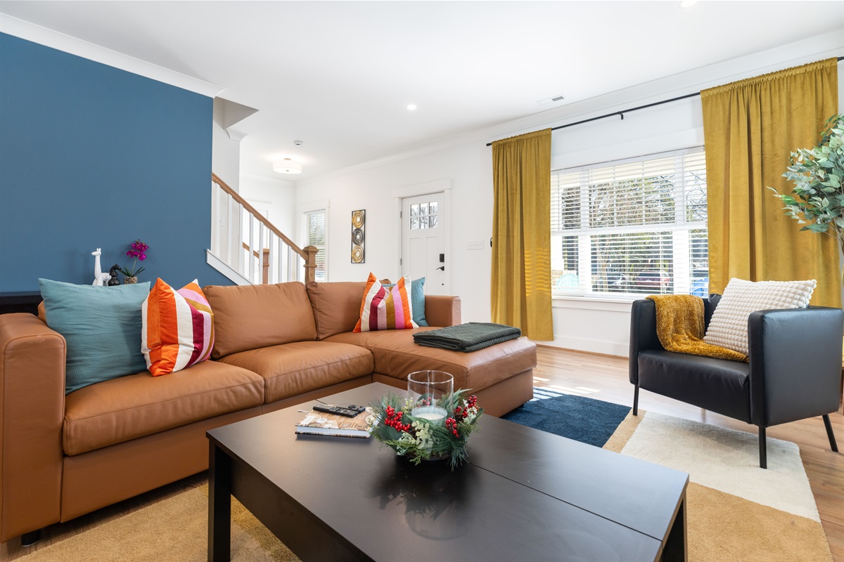 Your cozy living room: style and comfort, complete with decorative pillows, throw blankets, candles, and modern decor.