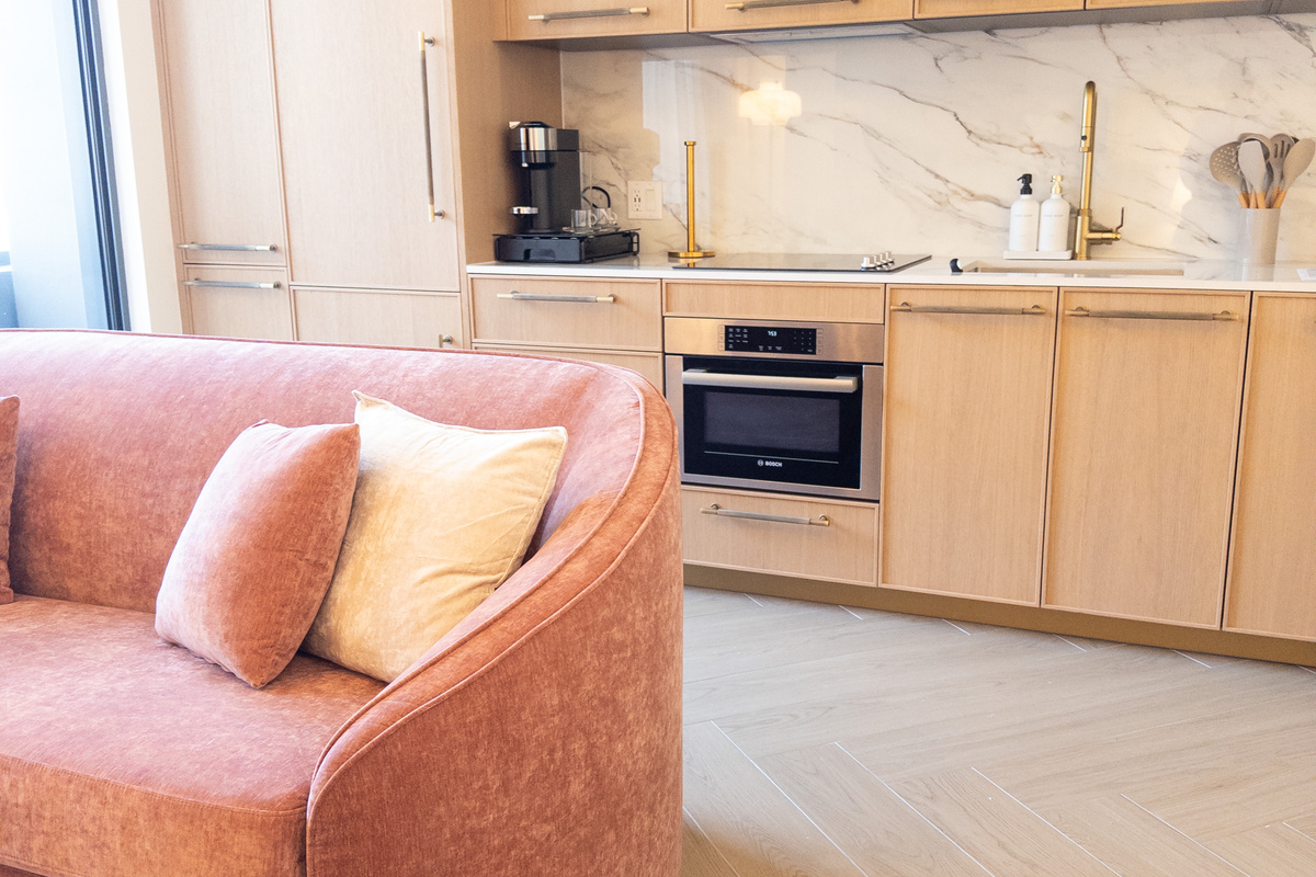 Open kitchenette flows into the living area - cook while you stay in the conversation.