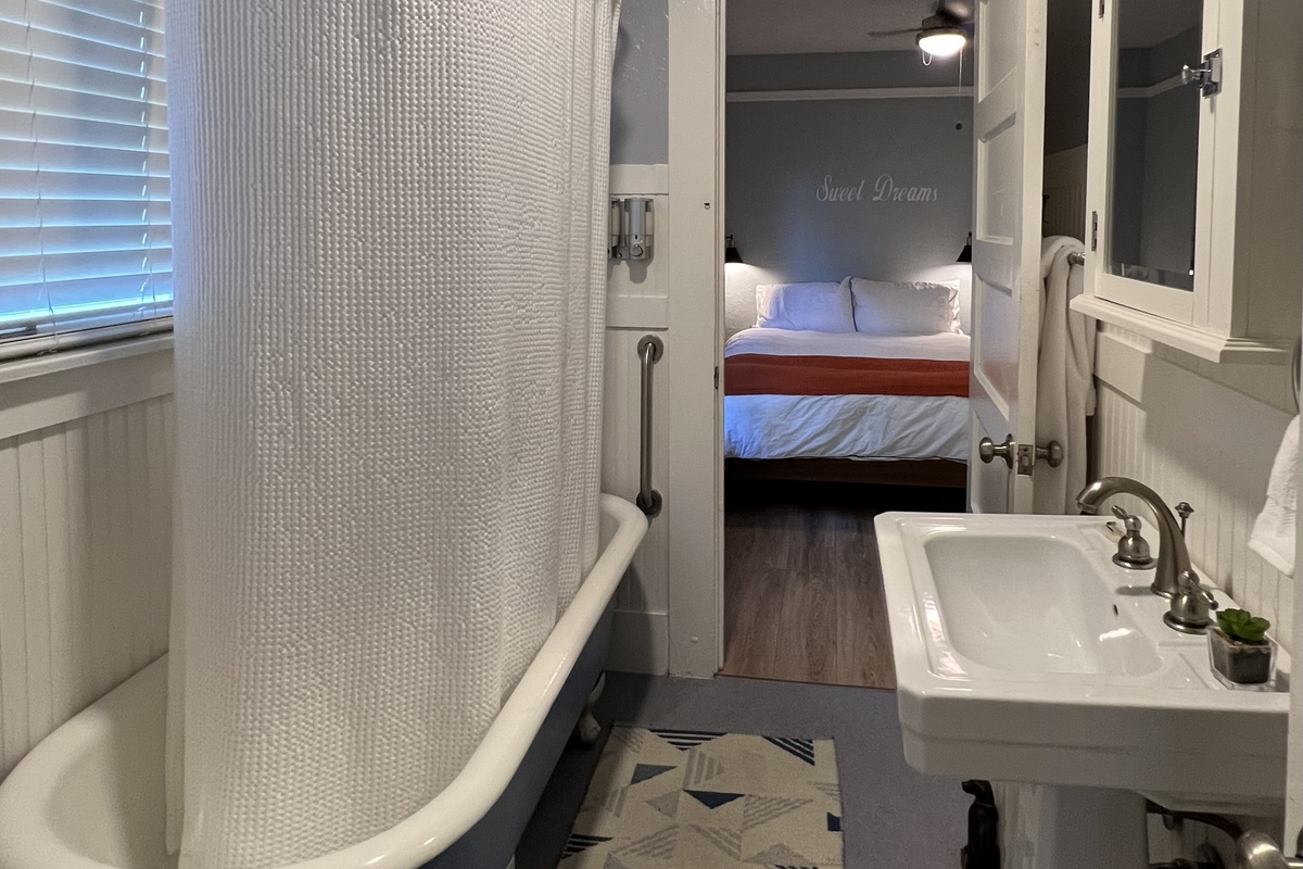 Ensuite full bath with a deep soaking clawfoot tub
