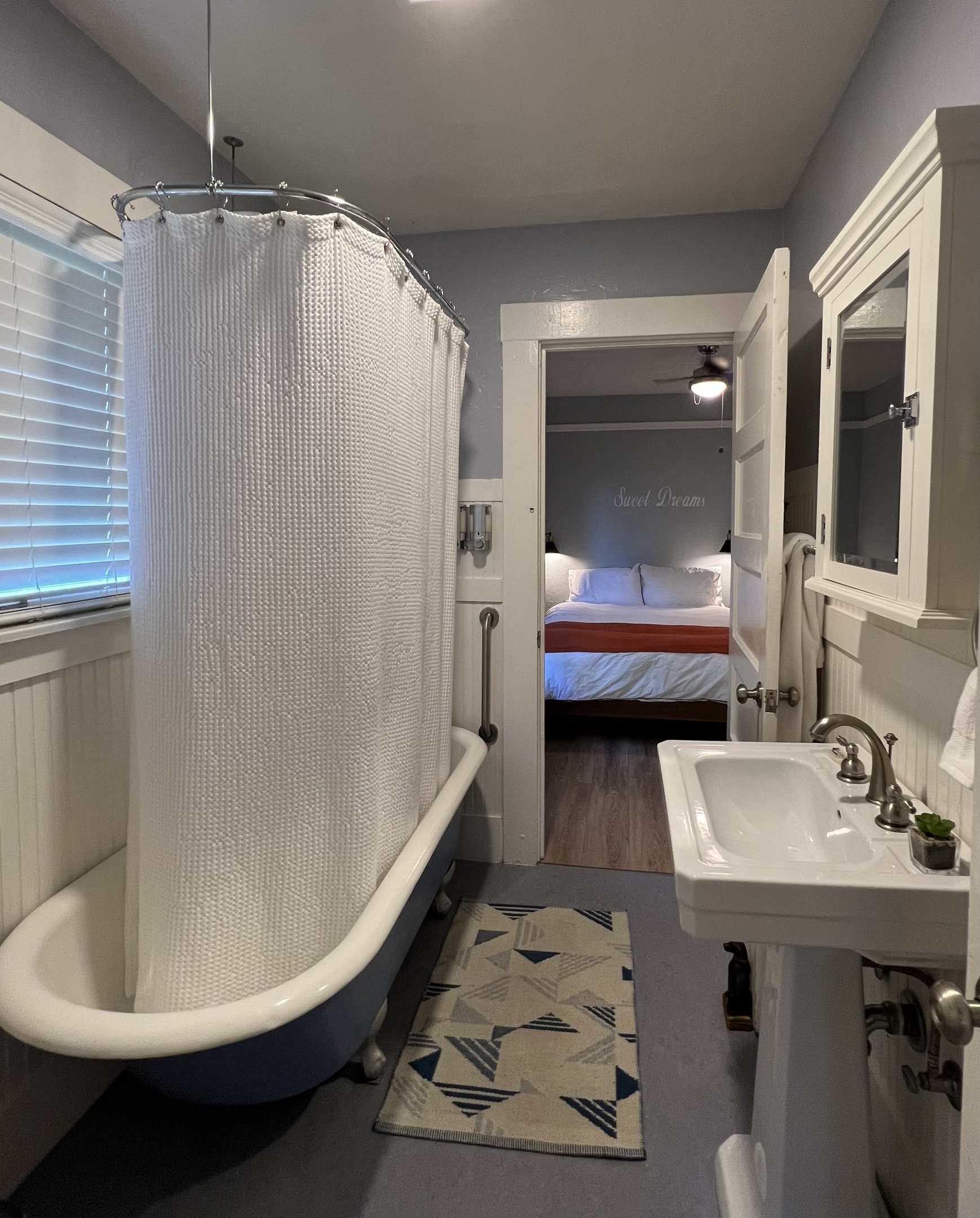 Ensuite full bath with a deep soaking clawfoot tub