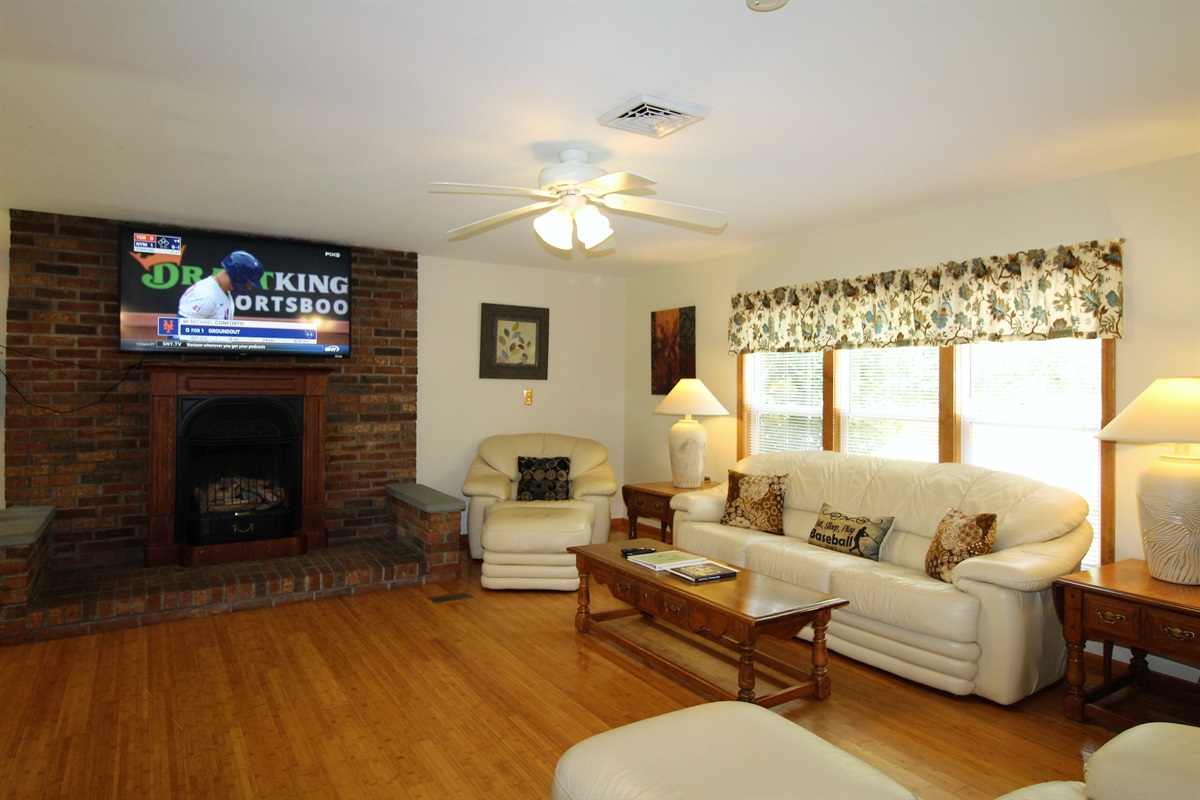 Spacious living room with leather furniture