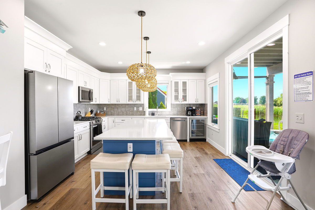 Enjoy a bright, open kitchen with plenty of natural light, a spacious island, and easy access to the patio for effortless indoor-outdoor living.
