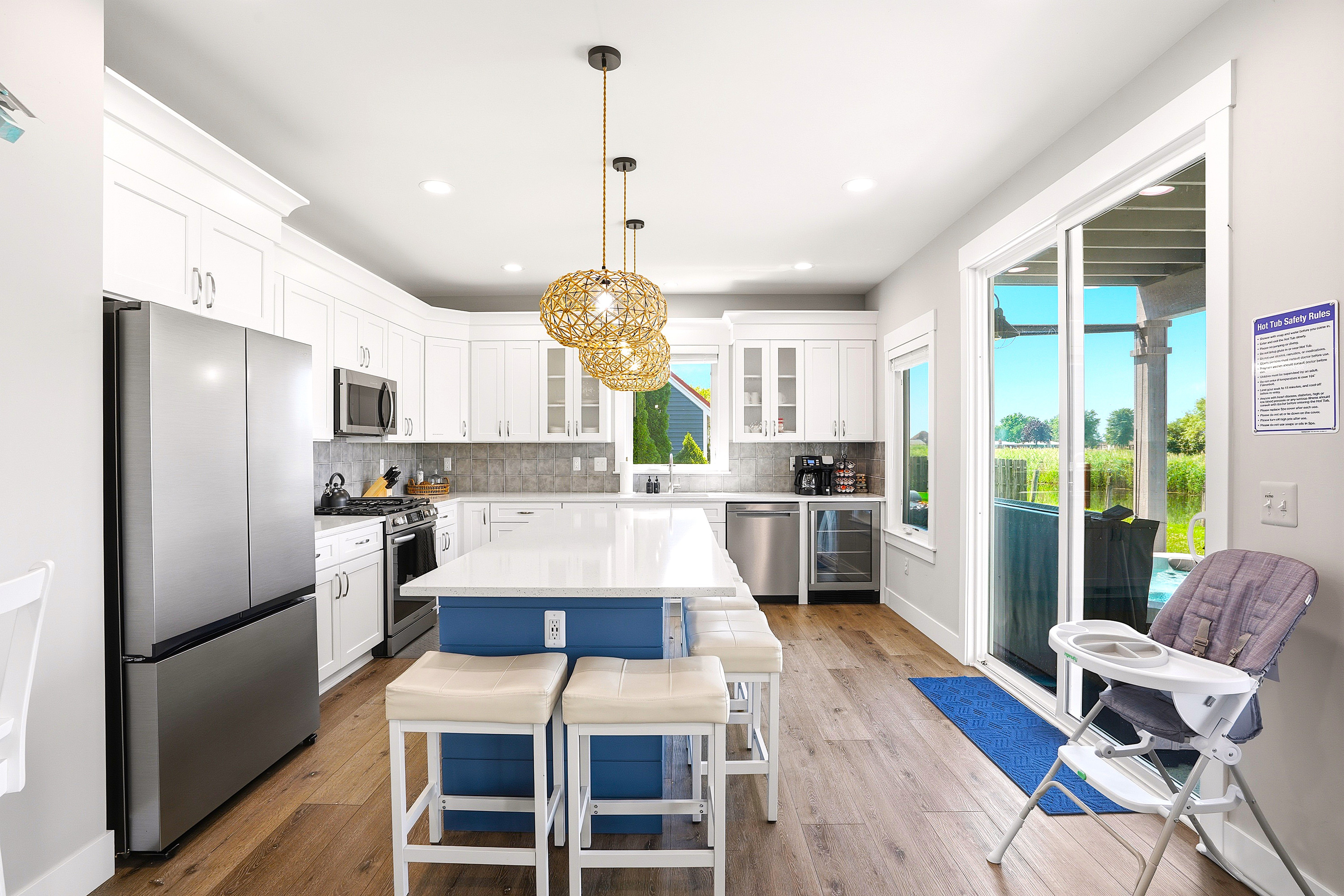 Enjoy a bright, open kitchen with plenty of natural light, a spacious island, and easy access to the patio for effortless indoor-outdoor living.