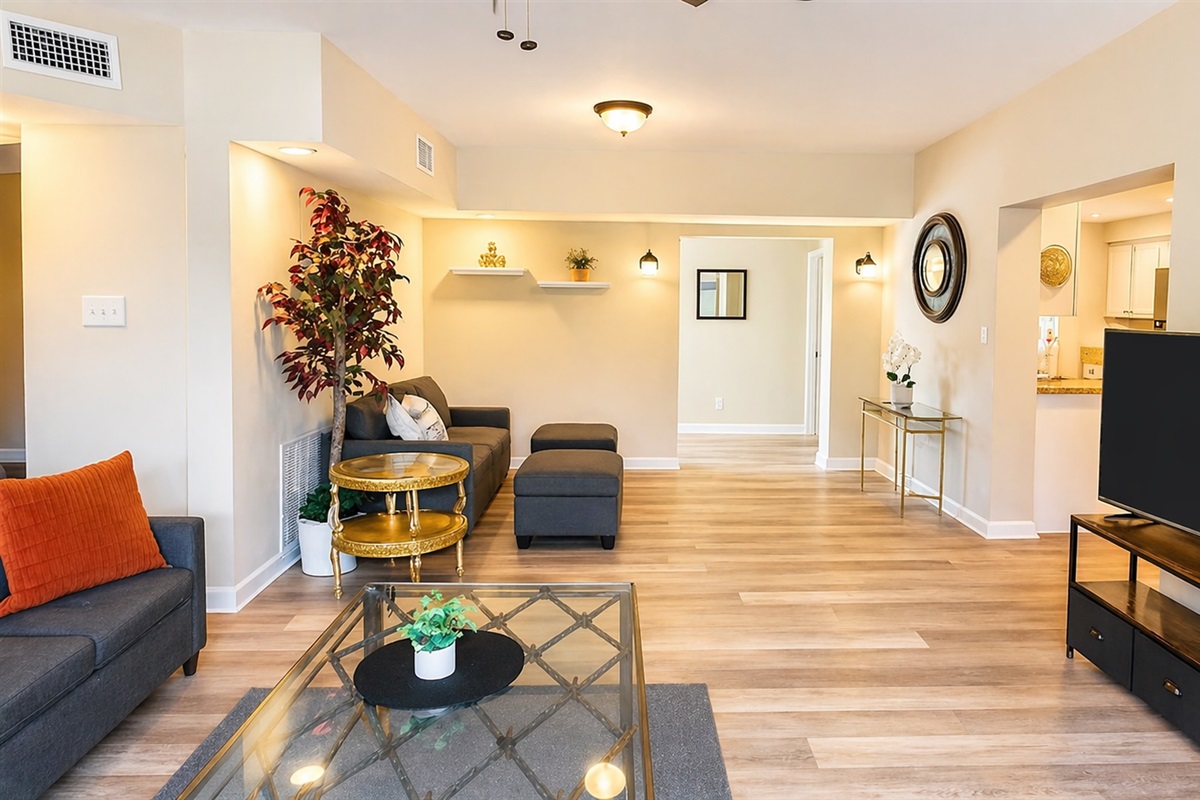Living Room - Spacious open concept living area with comfortable seating and entertainment center