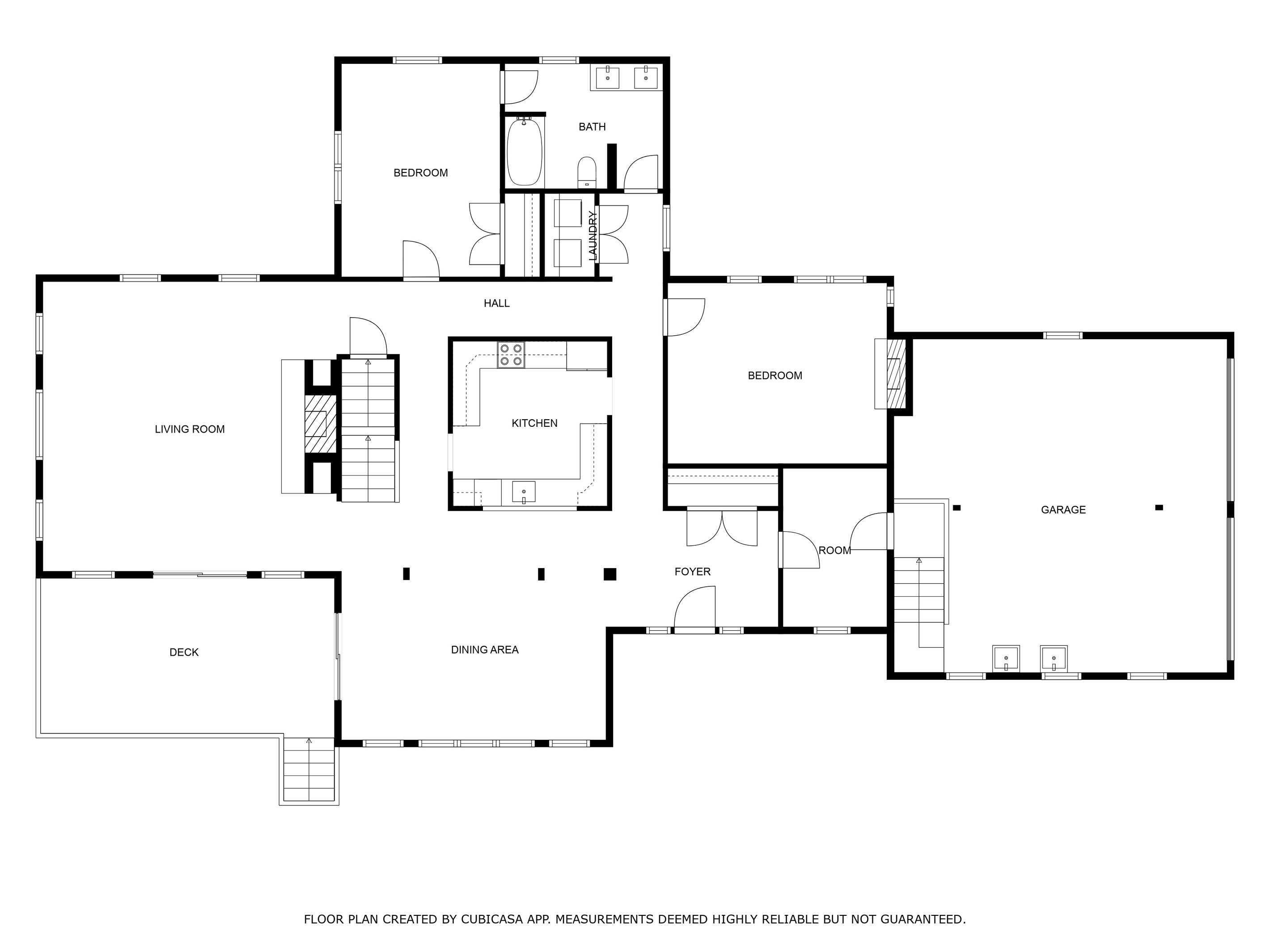 Main level floor plan with living room, kitchen, dining area, two bedrooms and deck