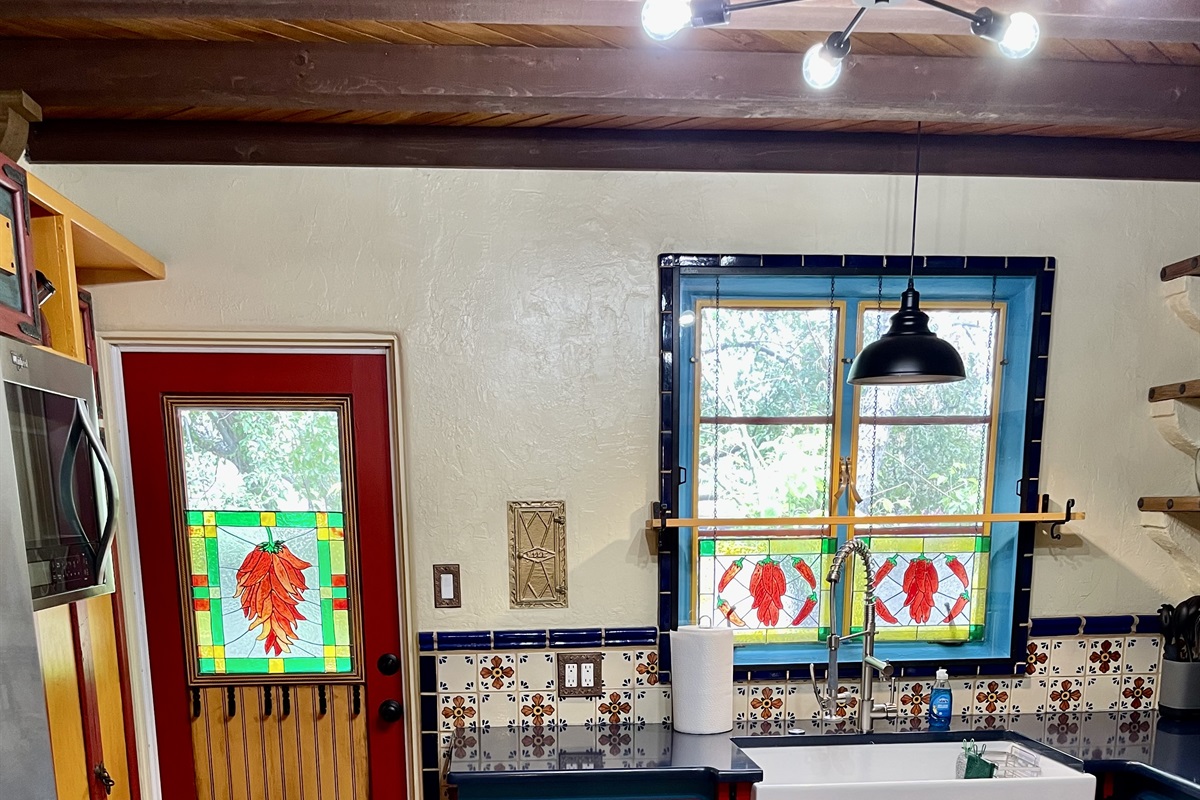 Hand-painted details and stained glass make this kitchen truly special.