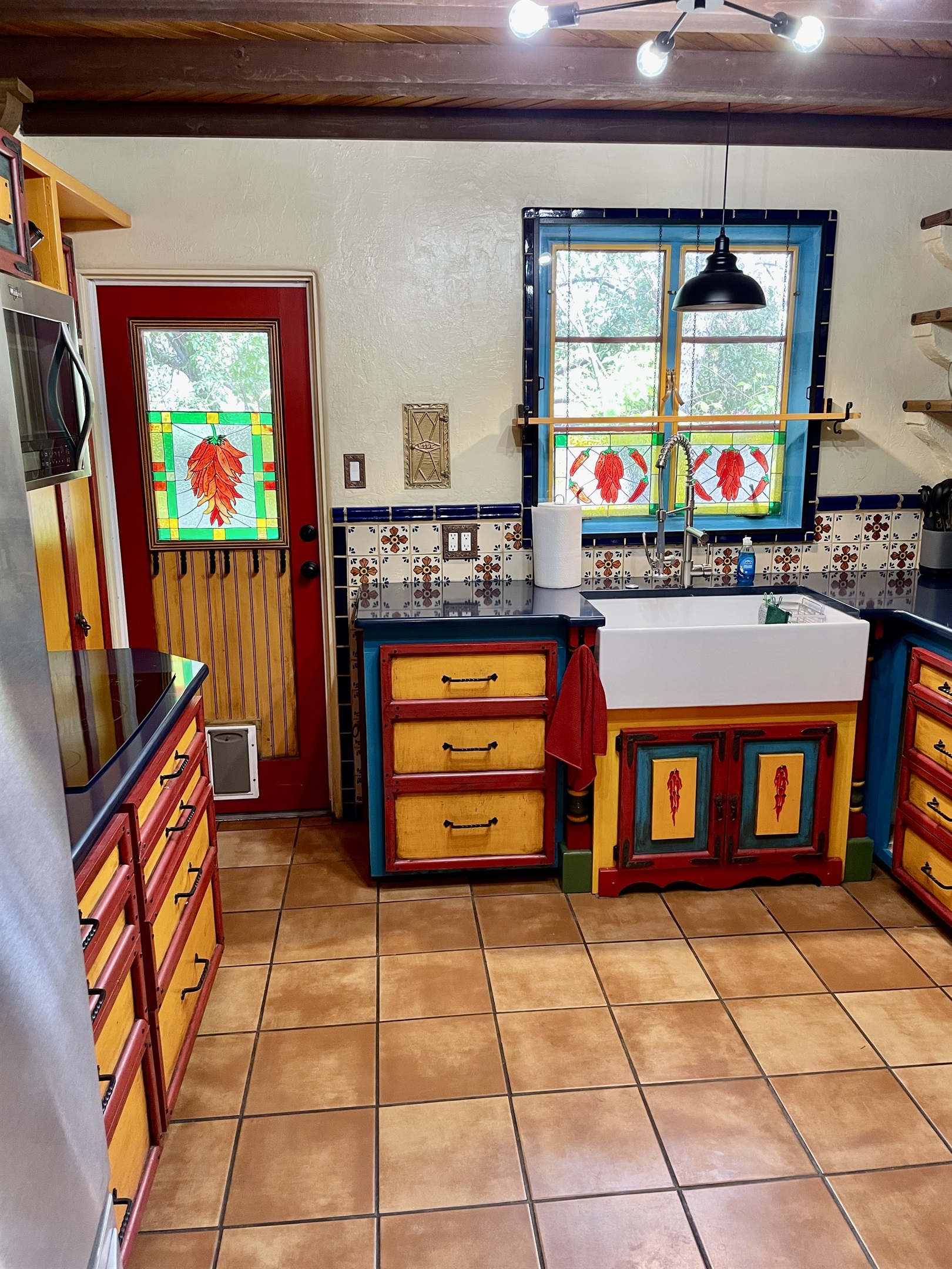 Hand-painted details and stained glass make this kitchen truly special.