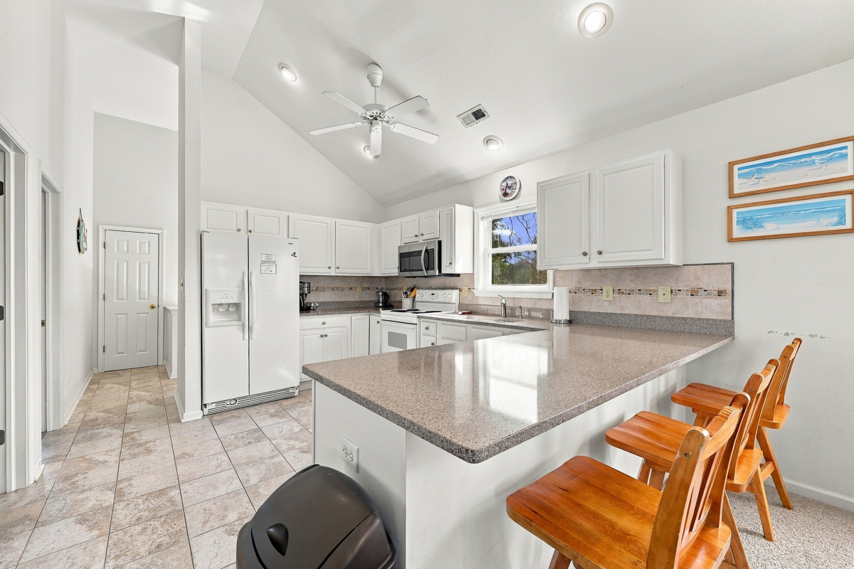 The dining area sits at the heart of the home, steps from the kitchen and living room.