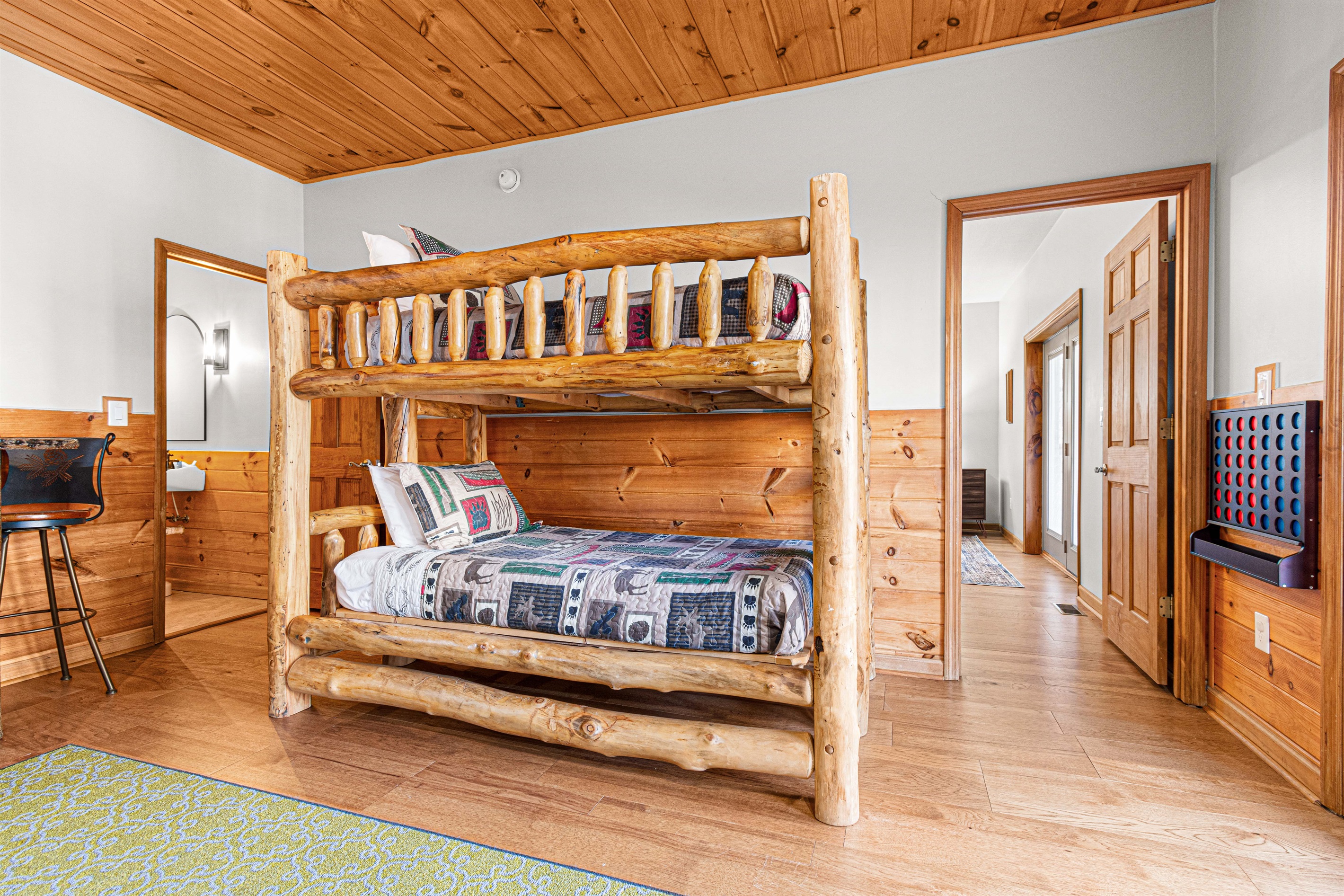 Half bathroom conveniently located near bunks.