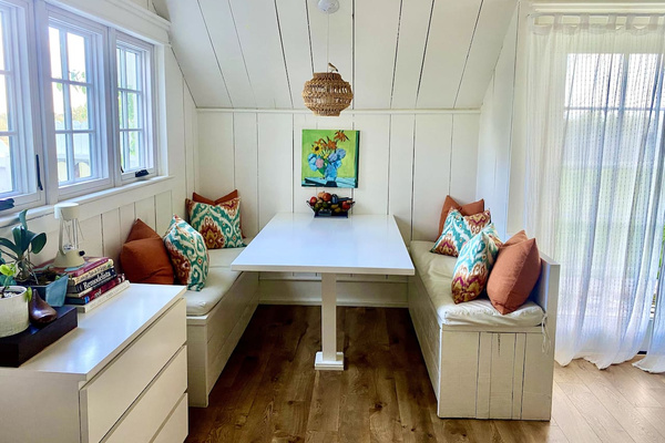 Charming, light filled breakfast nook.  Original art and special touches abound. 