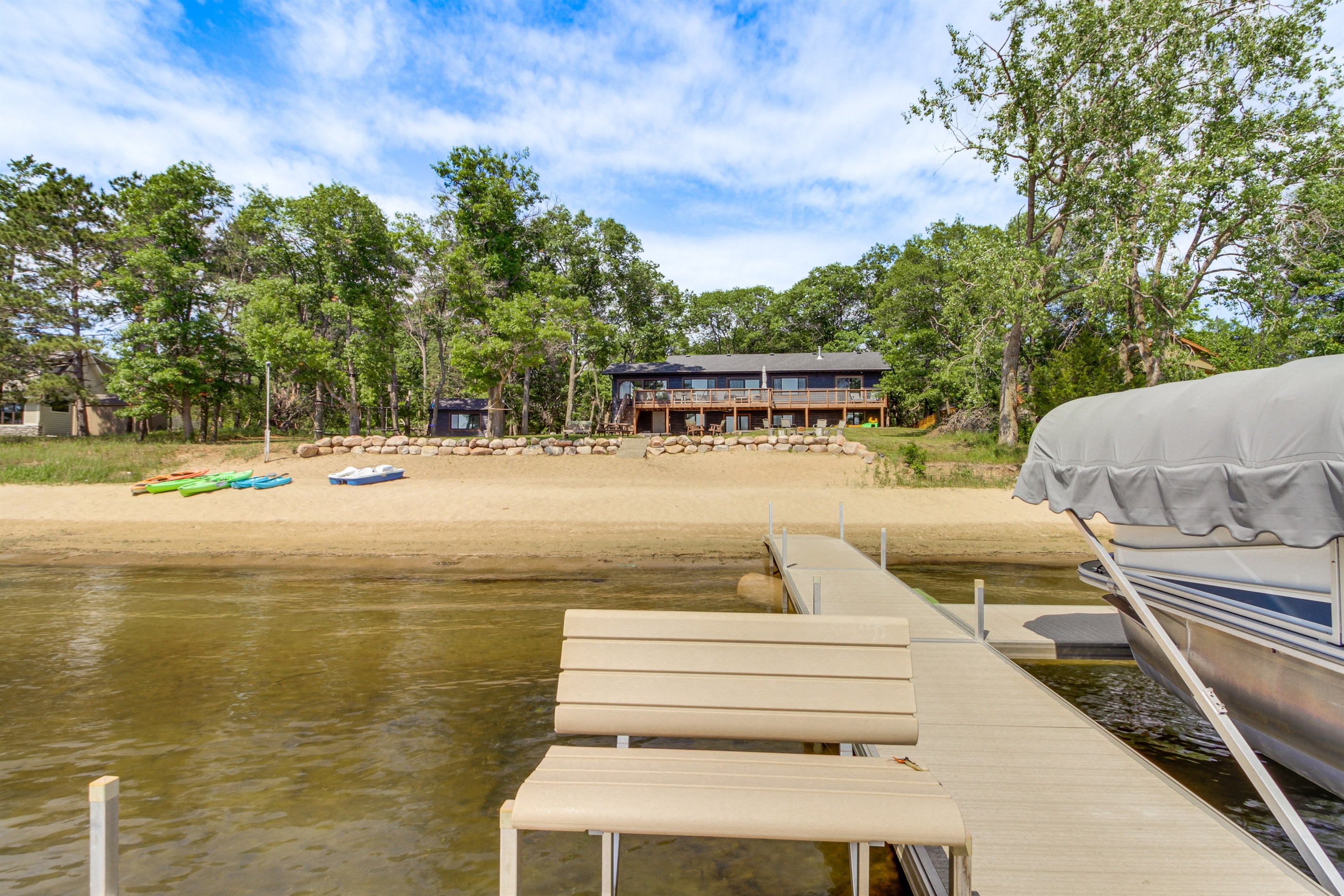 View from the dock looking back toward the beach and cabin—ideal for swimming and lounging
