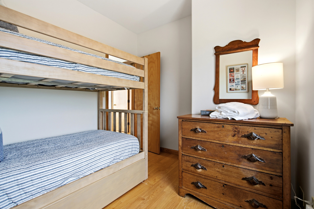 Bunk room with additional storage, perfect for kids or extra guests.