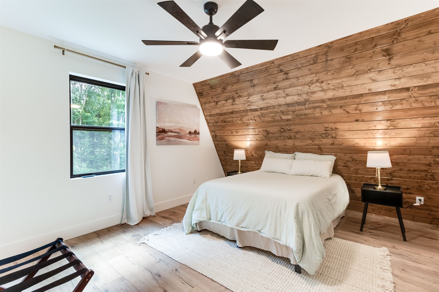 Downstairs bedroom with queen bed