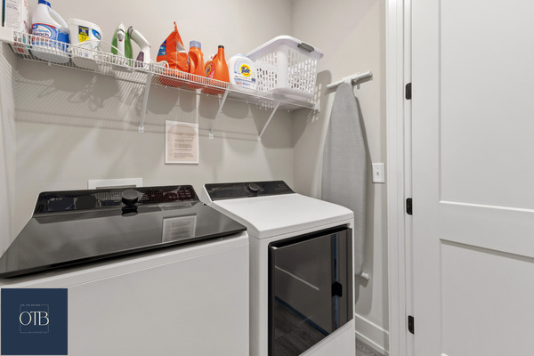 Full-size washer and dryer in the laundry closet on the third floor.