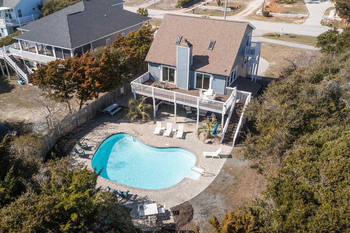 Aerial view of SeaEsta showcasing the private pool, spacious deck, and surrounding coastal setting