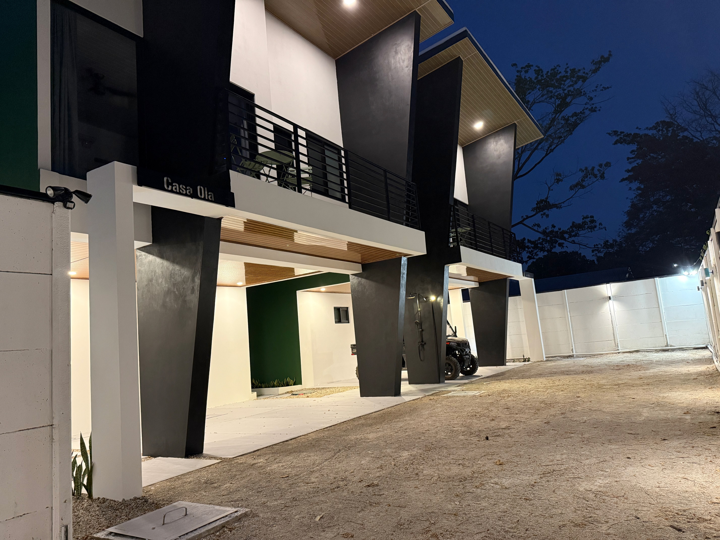 The compound at night. Warm, lit, feels like coming home.