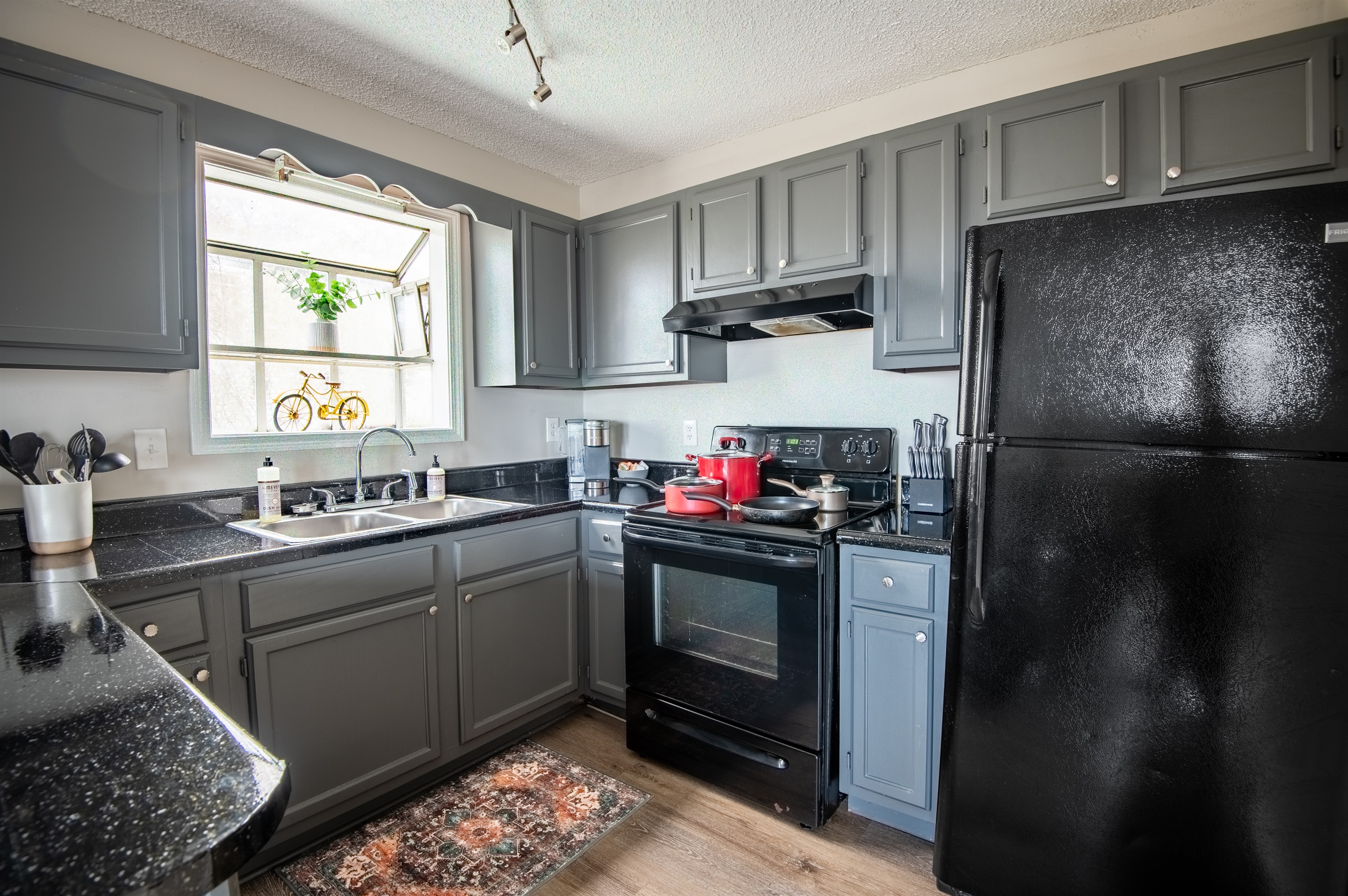 Enjoy Unit A's full kitchen, complete with everything you can think of (even a water filter pitcher in the fridge!)