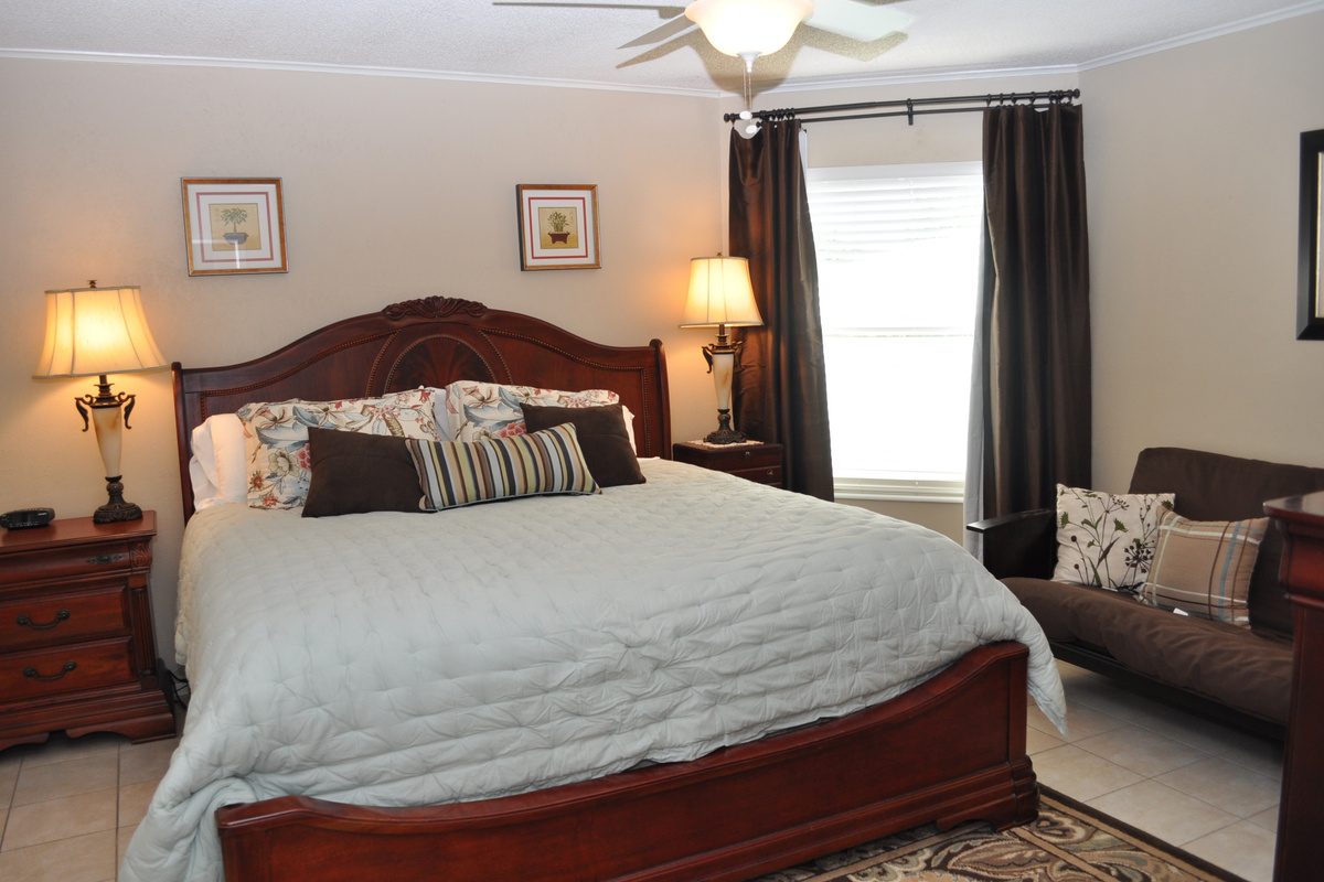 Spacious primary bedroom with futon for flexible options.