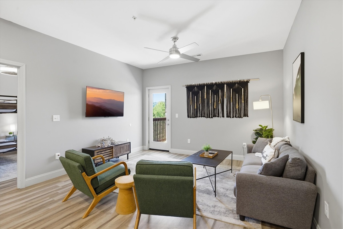 Everything flows through this space—comfortable seating, open layout, and a TV that keeps it just as good for quiet nights as it is for a full group.