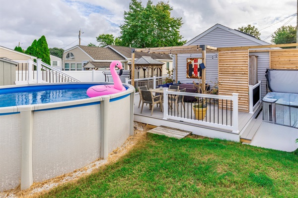 backyard oasis! pool, hot tub, fire table, outdoor shower, dining AND lounge area!