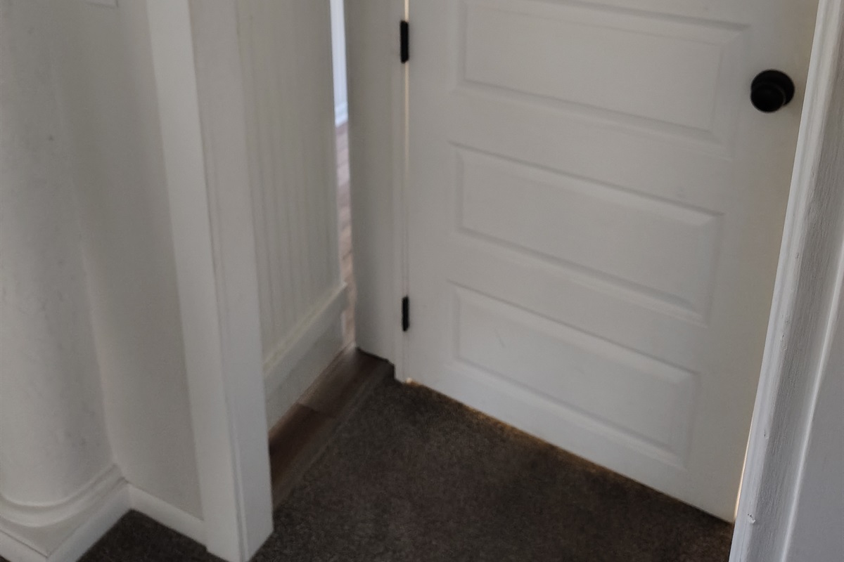 Close door to upstairs and see secret door behind