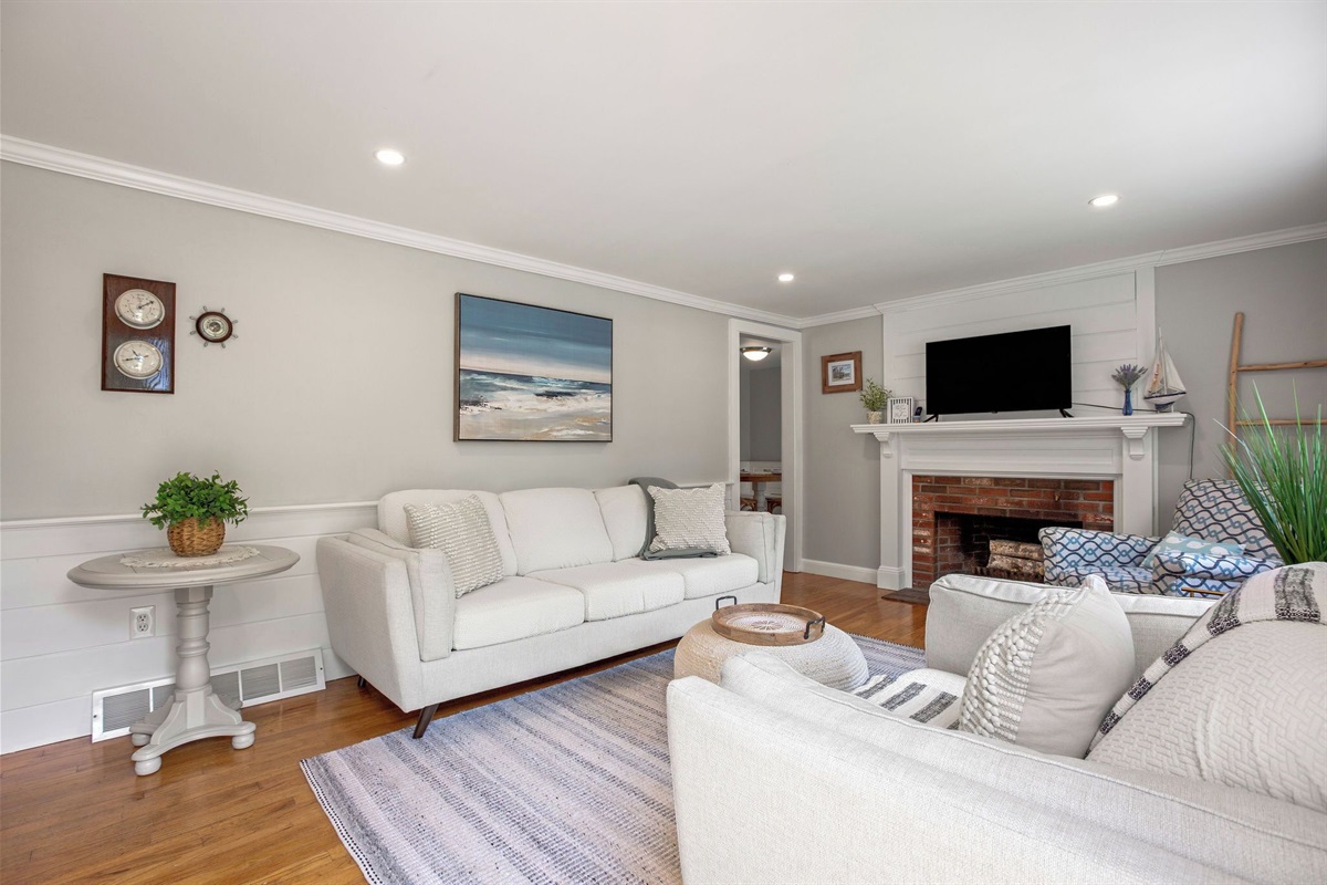 Relax and recharge in this airy living space, where soft textures and ocean hues bring the coast indoors.