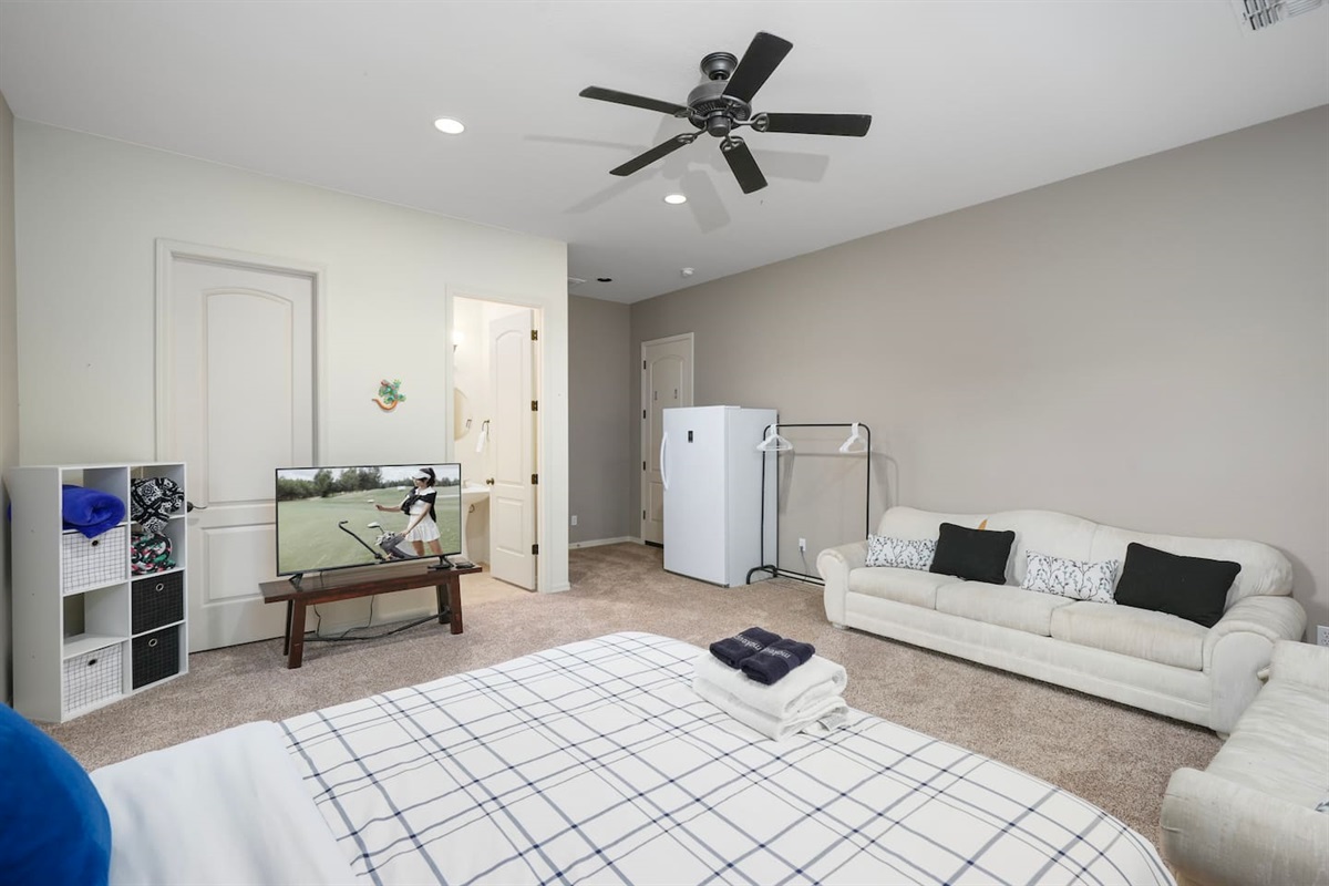 Spacious casita suite featuring Smart TV, comfortable sofa seating, and open layout.