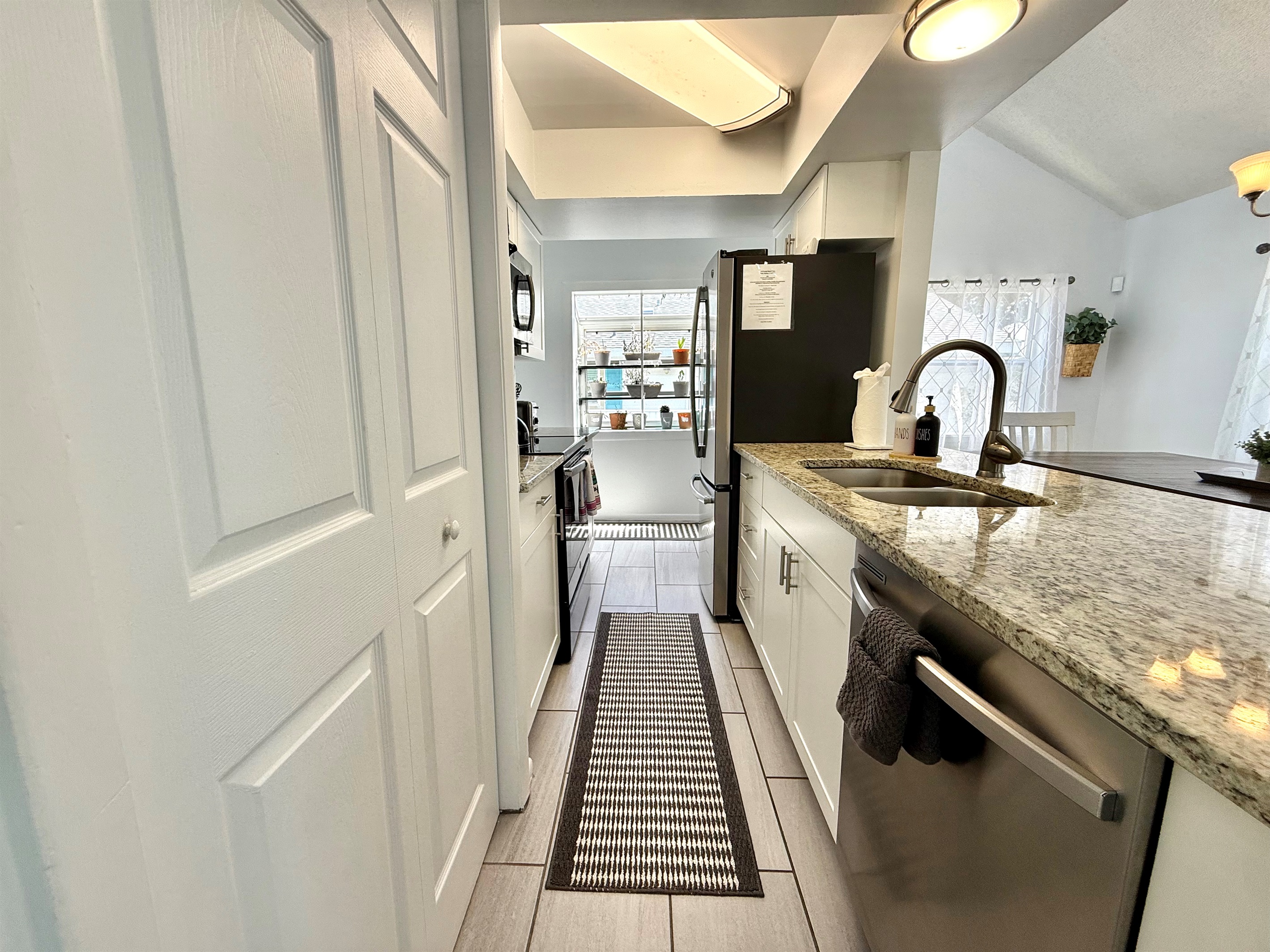 A minimalist, modern aesthetic makes this kitchen a clean and clutter-free space to cook and gather.