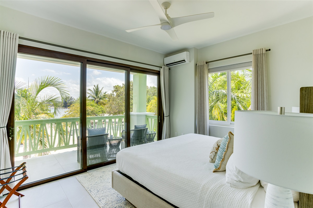 Bedroom 1: King Bed with Outside Seating and Beach View