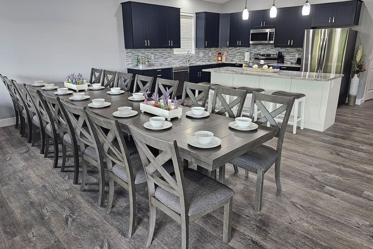 Spacious dining table ready for shared meals, celebrations, and memories.  Seating for 16.