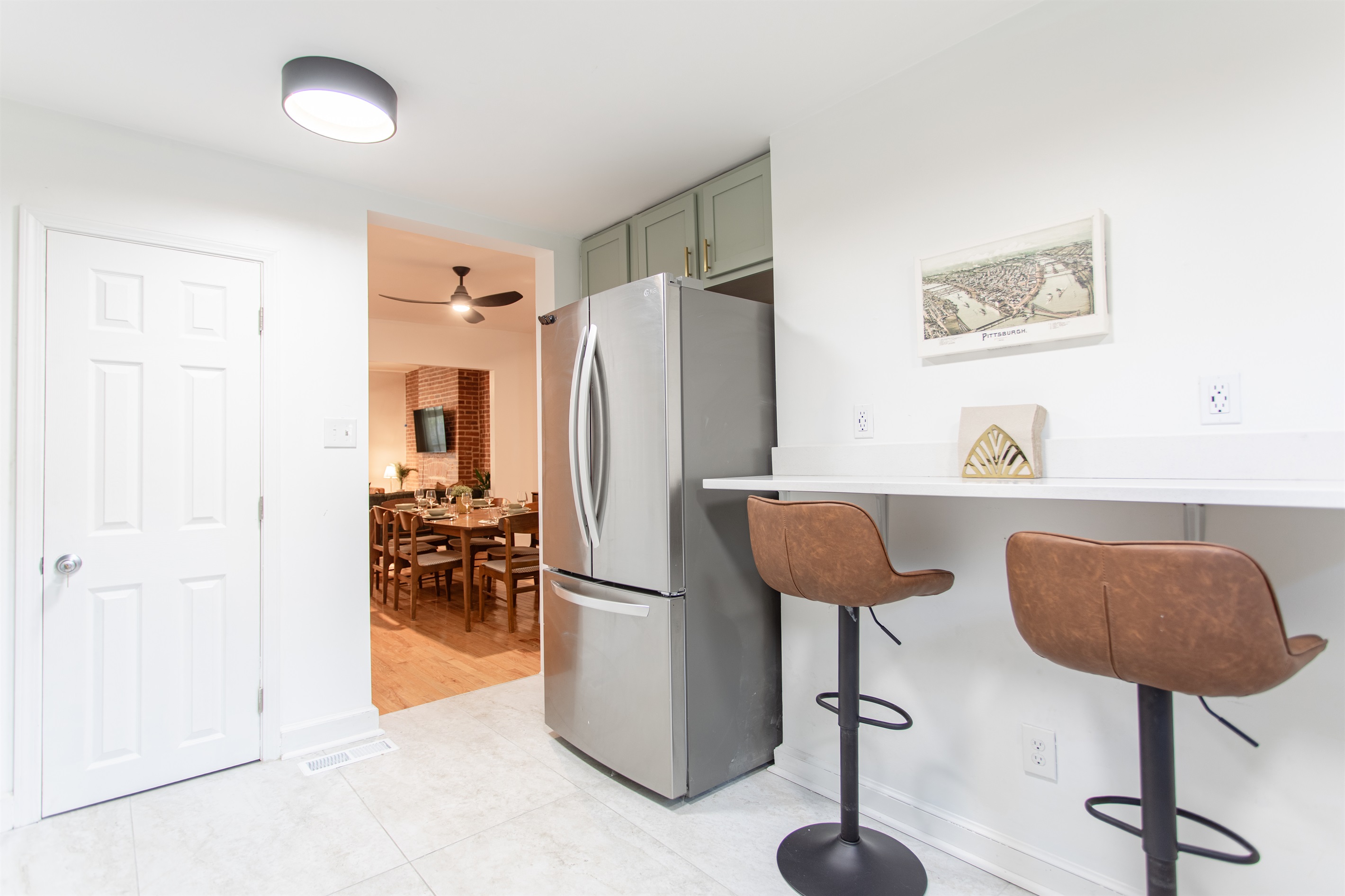 Sleek breakfast bar offering additional seating alongside the main dining area.