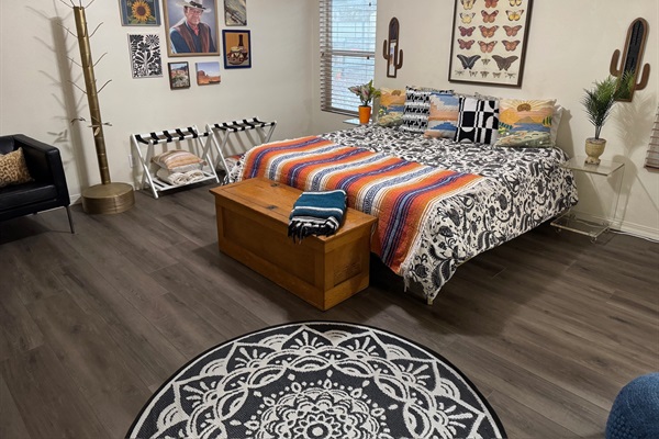 Bedroom 1 featuring a king bed and en suite bathroom