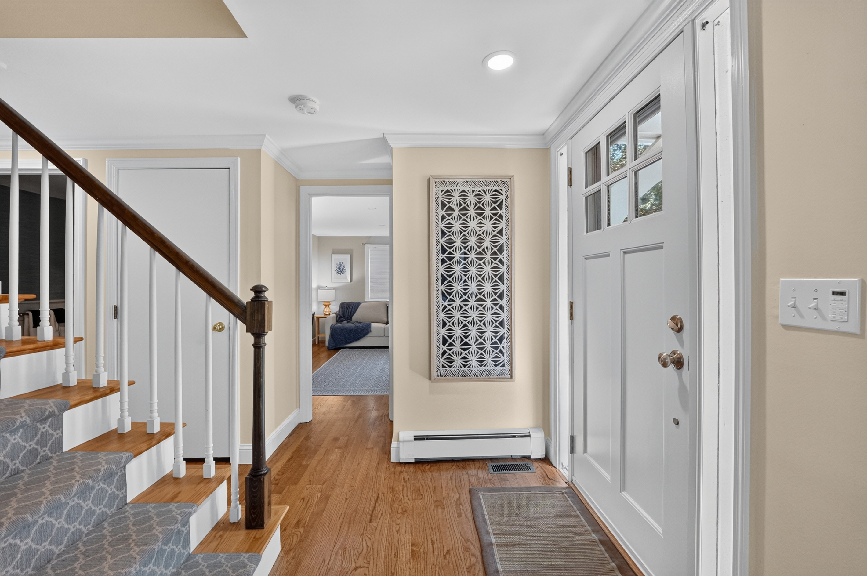 Bright and welcoming entryway with easy access to the home's main living spaces.