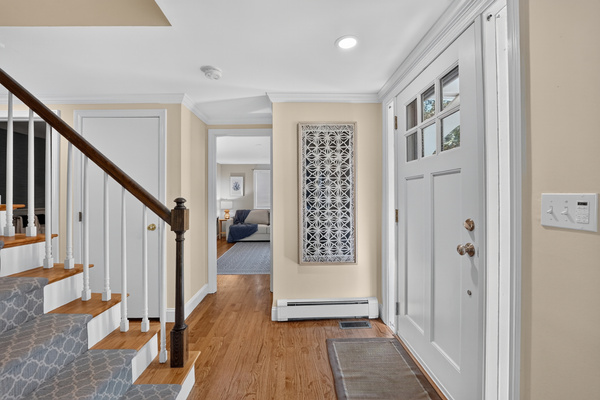 Bright and welcoming entryway with easy access to the home's main living spaces.