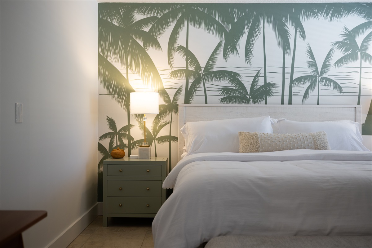 Wake up in paradise ✨
A serene bedroom with lush palm details and hotel-style comfort.