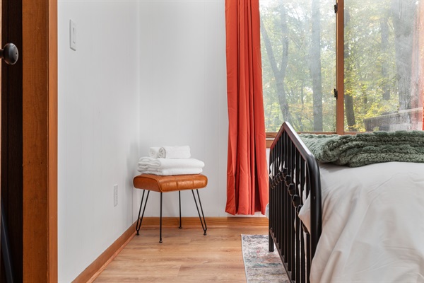 Relax in a comfortable Queen bed with soft linens and towels ready for your stay.