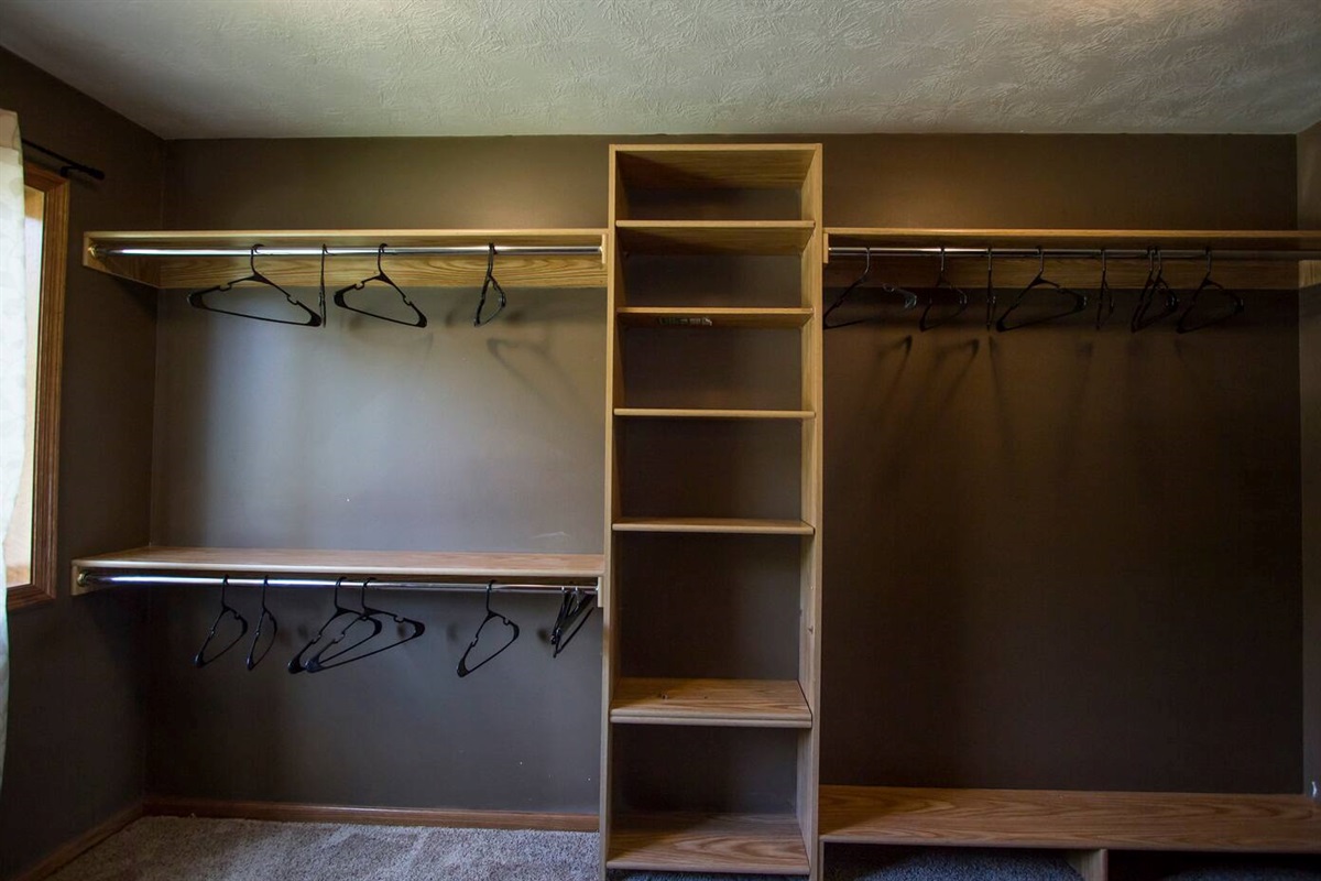 Closet with storage shelves.
